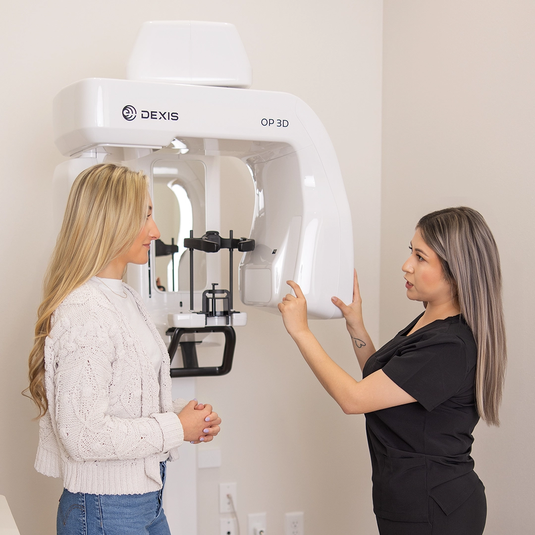 fauchard dentistry patient at the digital xray machine with dental assistant